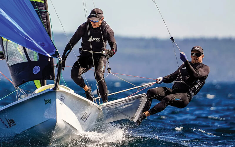 Two sailors using marine equipment from Fosters sailing supplies store